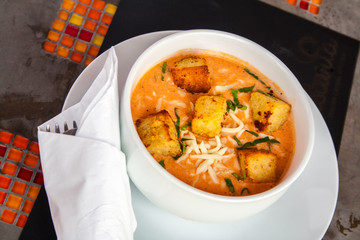 Cream of tomato with croutons and condiments