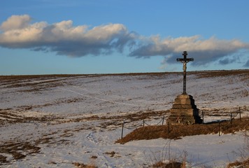 Cross in middle of the meadows.