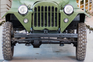 The old bus. Facade of the vehicle. Wheels. Lights.