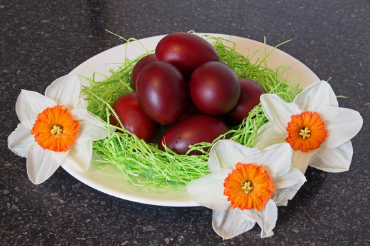 Red Easter eggs and flowers