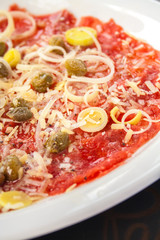 Carpaccio of salmon with cheese and Olives