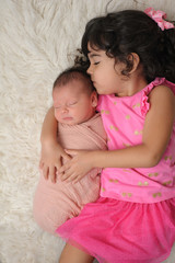 Toddler and Newborn Baby Sister Portrait