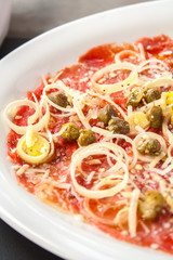 Carpaccio of salmon with cheese and Olives