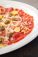 Carpaccio of salmon with cheese and Olives