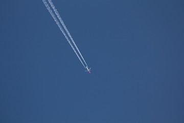 Airplane on blue sky.
