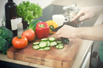 Cooking meal in the kitchen. Healthy food, chopping vegetables