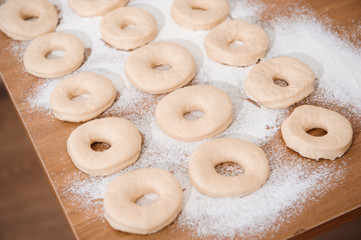 Chef preparing dough - cooking donuts process