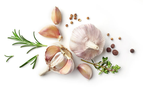 garlic and herbs on white background