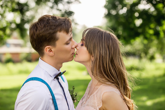 Bride and groom kissing outdoor. Wedding kiss