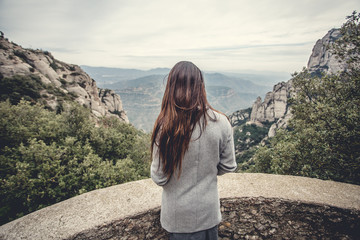 Young girl in the mountains, walk on the wild