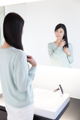 attractive asian woman in powder room