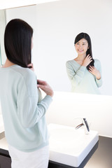 attractive asian woman in powder room