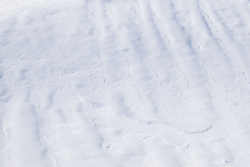 Fototapeta na wymiar surface of snow looking like cream in a sunny day