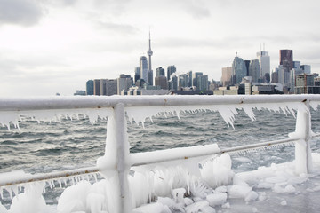 Skyline of Toronto during winter season with ice in Lake Ontario