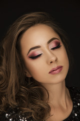 Beautiful girl portrait with makeup and closed eyes