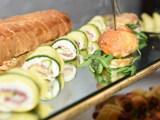 zucchini slices with mozzarella and ham with bread and rolls