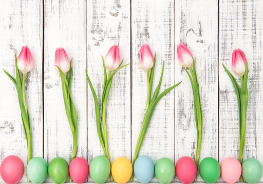 Easter decoration eggs tulip flowers wooden background