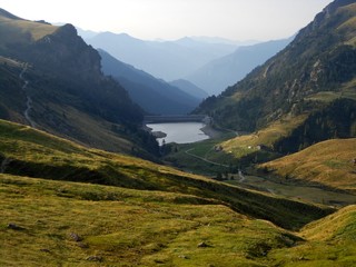 View of alpine lake with dam