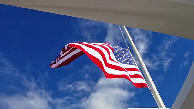 American Flag at memorial monument at Pearl Harbor of USS Arizona BB 39 in Honolulu Hawaii, Oahu island of United States. National historic landmark.Patriotic concept