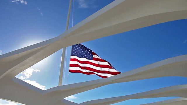 Arizona patriotic memorial American Flag at Pearl Harbor of USS Arizona BB 39 national historic monument in Honolulu Hawaii, Oahu island of United States.