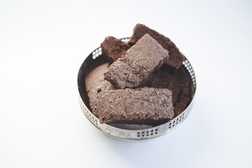 Chocolate brownies in a vintage silver bowl