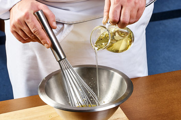 Whisking vigorously to disperse oil Making Mayonnaise oil