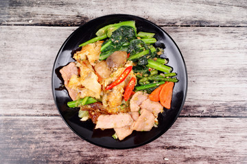 Fried big noodle topped mixed vegetables for organic food.