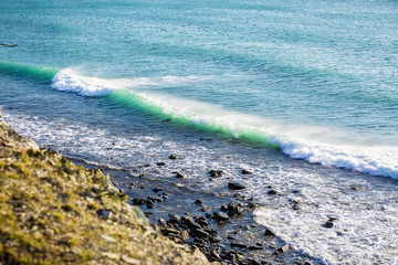 Ocean waves and rocks on shore