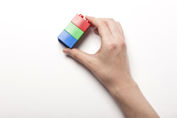 woman hand hold color block(red, green, blue) isolated white