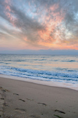 Sunset on the beach. Colorful dawn over the sea. Dramatic sky