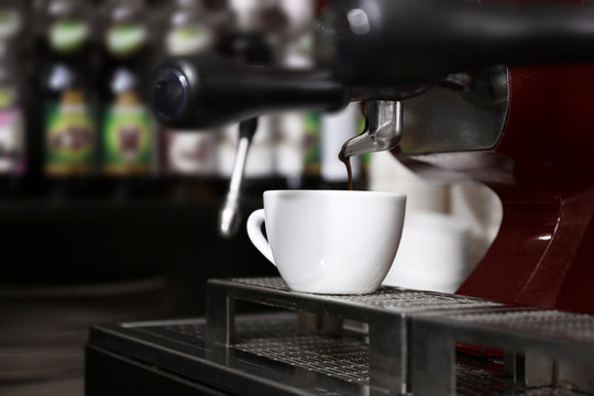 Coffee machine with cup, closeup