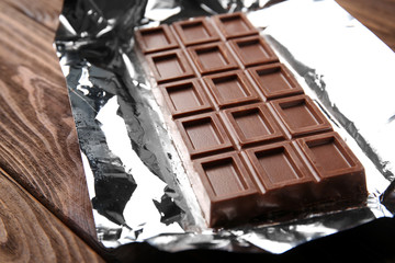 Chocolate bar on foil, closeup