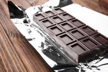 Chocolate bar on foil, closeup