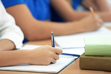 Students learning at table, closeup