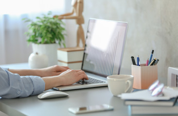 Woman working on laptop at home