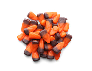 Colorful Halloween candies on white background