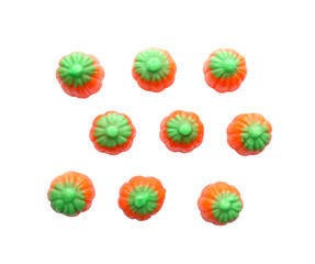 Colorful Halloween candies on white background