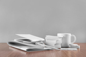 Blank goods on wooden table and grey background