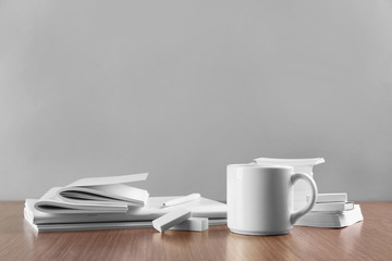 Blank goods on wooden table and grey background