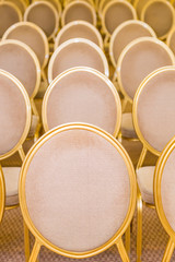rank of empty chairs in vintage style