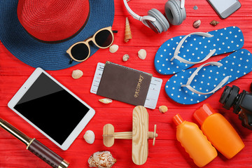 Travel accessories on color  wooden background