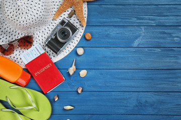 Travel accessories on color  wooden background