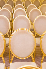 rank of empty chairs in vintage style