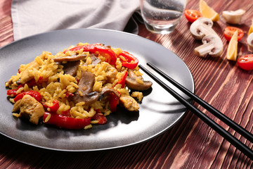 Traditional rice with vegetables on black plate