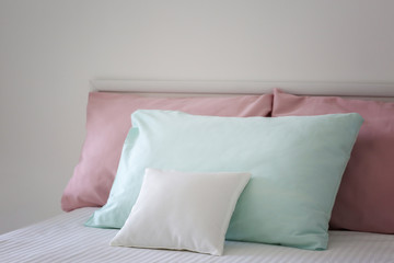 Fototapeta na wymiar Blank soft pillow on bed