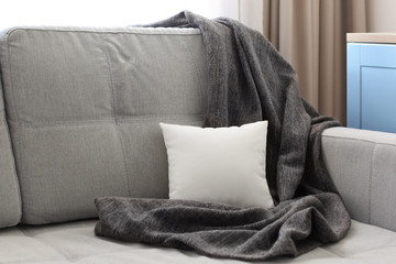 Blank soft pillow on sofa