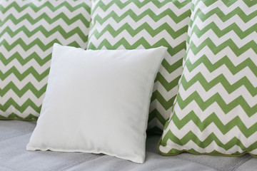 Blank soft pillow on sofa