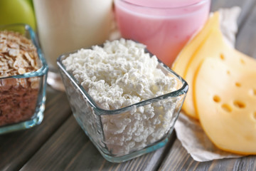 Different dairy products on wooden background