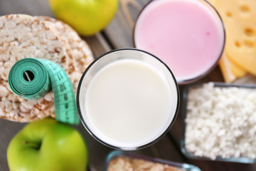 Different dairy products on wooden background