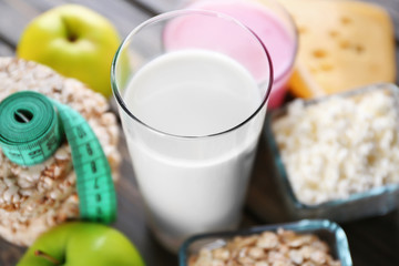 Different dairy products on wooden background